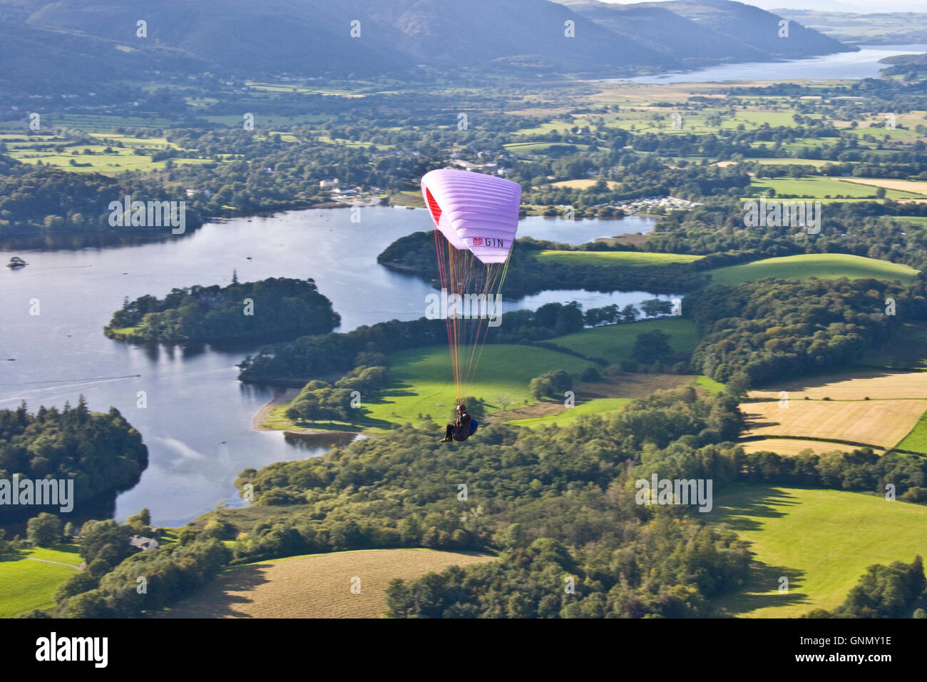 Paraglider over Derwent Water near Keswick in Cumbria, UK Stock Photo