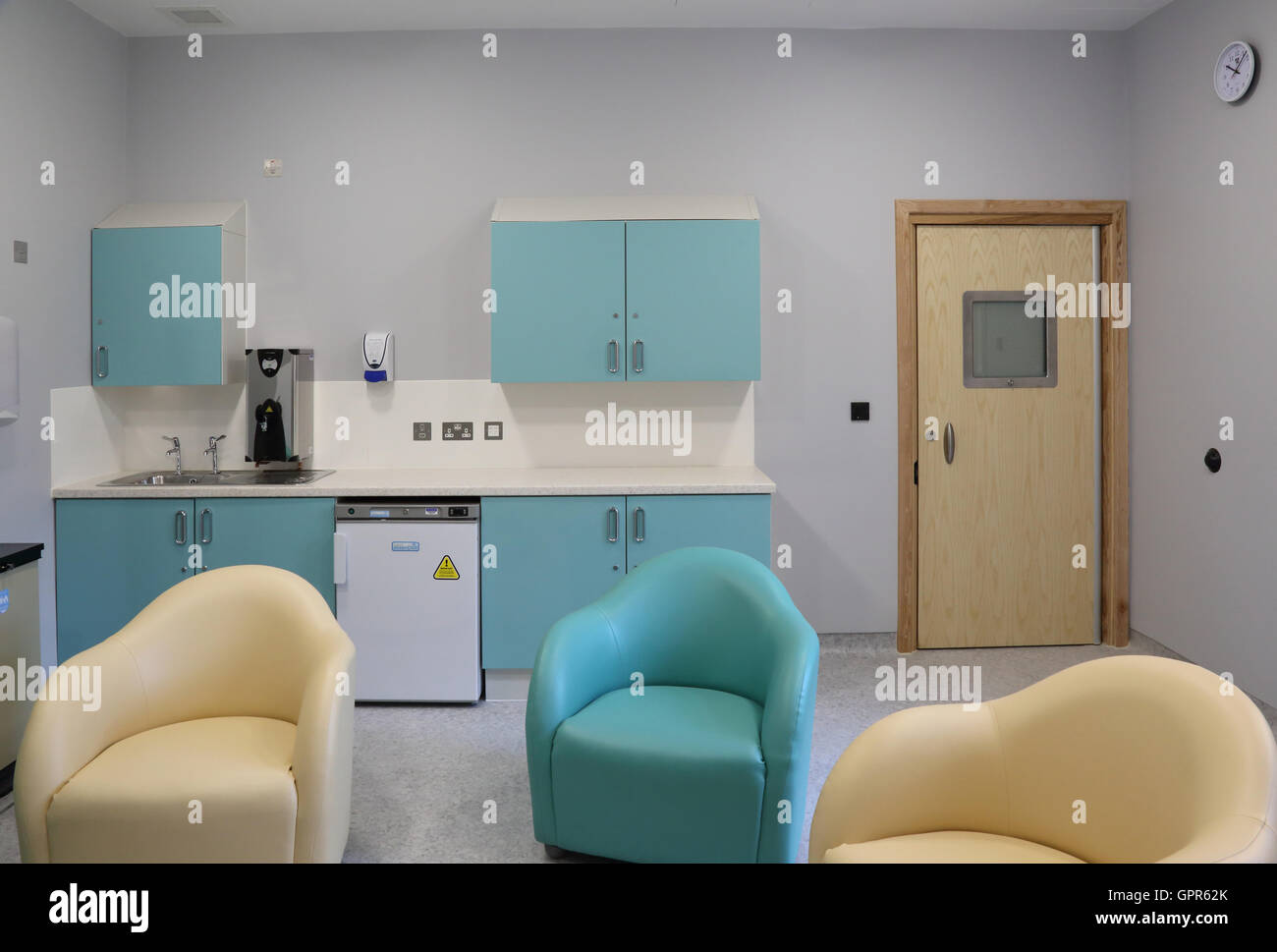 Visiting room in a new secure psychiatric hospital unit - shows specialist furniture and high-security door Stock Photo