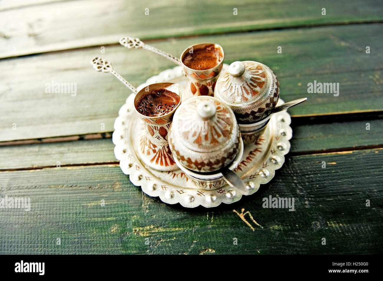 Two cups of bosnian traditional coffee on a wooden table Stock Photo