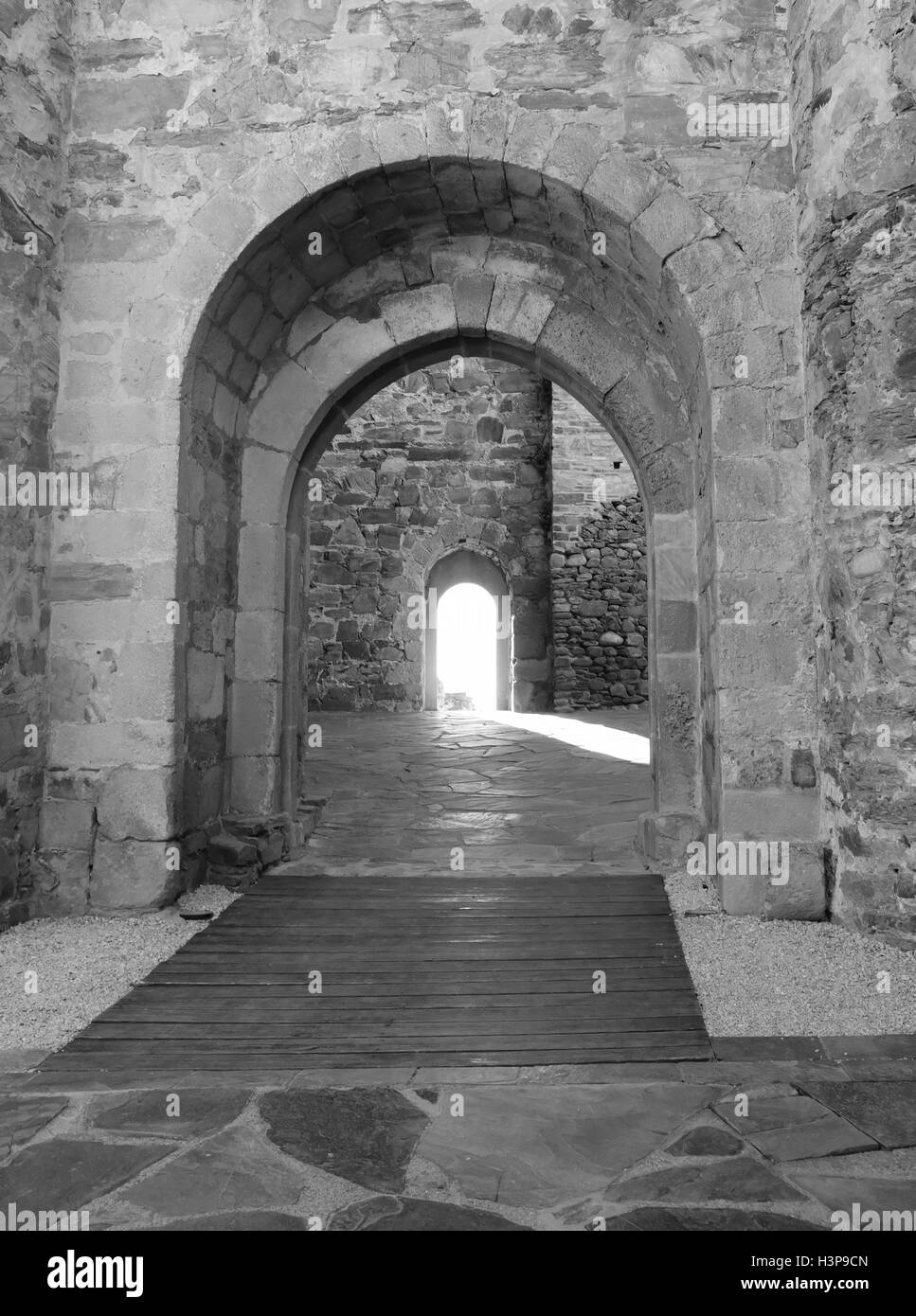 Castle walkway with stream of light in the distance in Ponferrada, Spain. Stock Photo