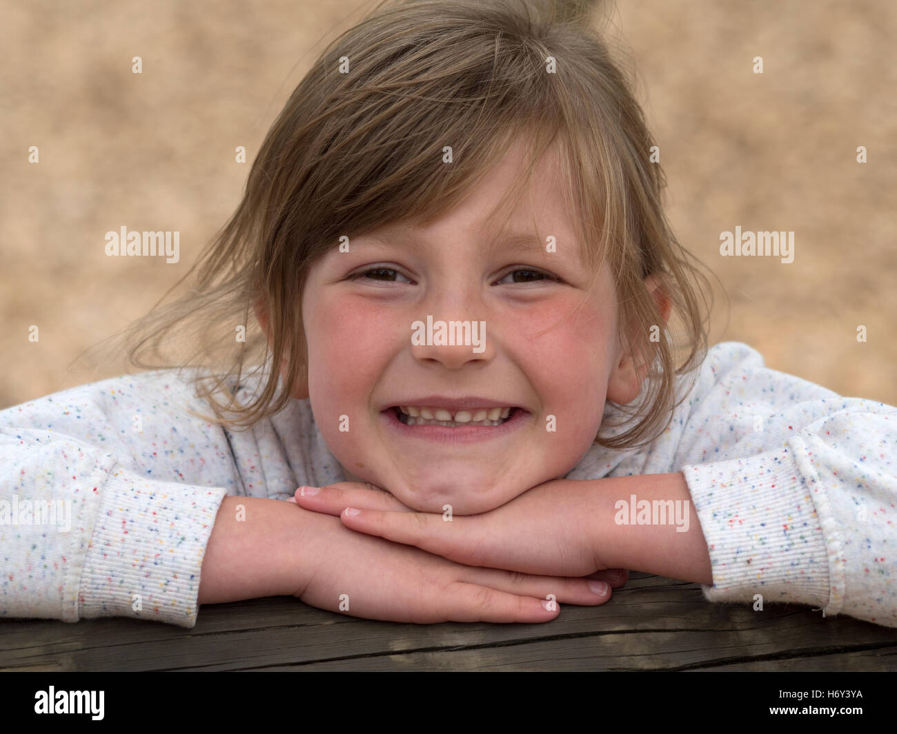 Young 6 year old girl playing and posing at a playground. Stock Photo