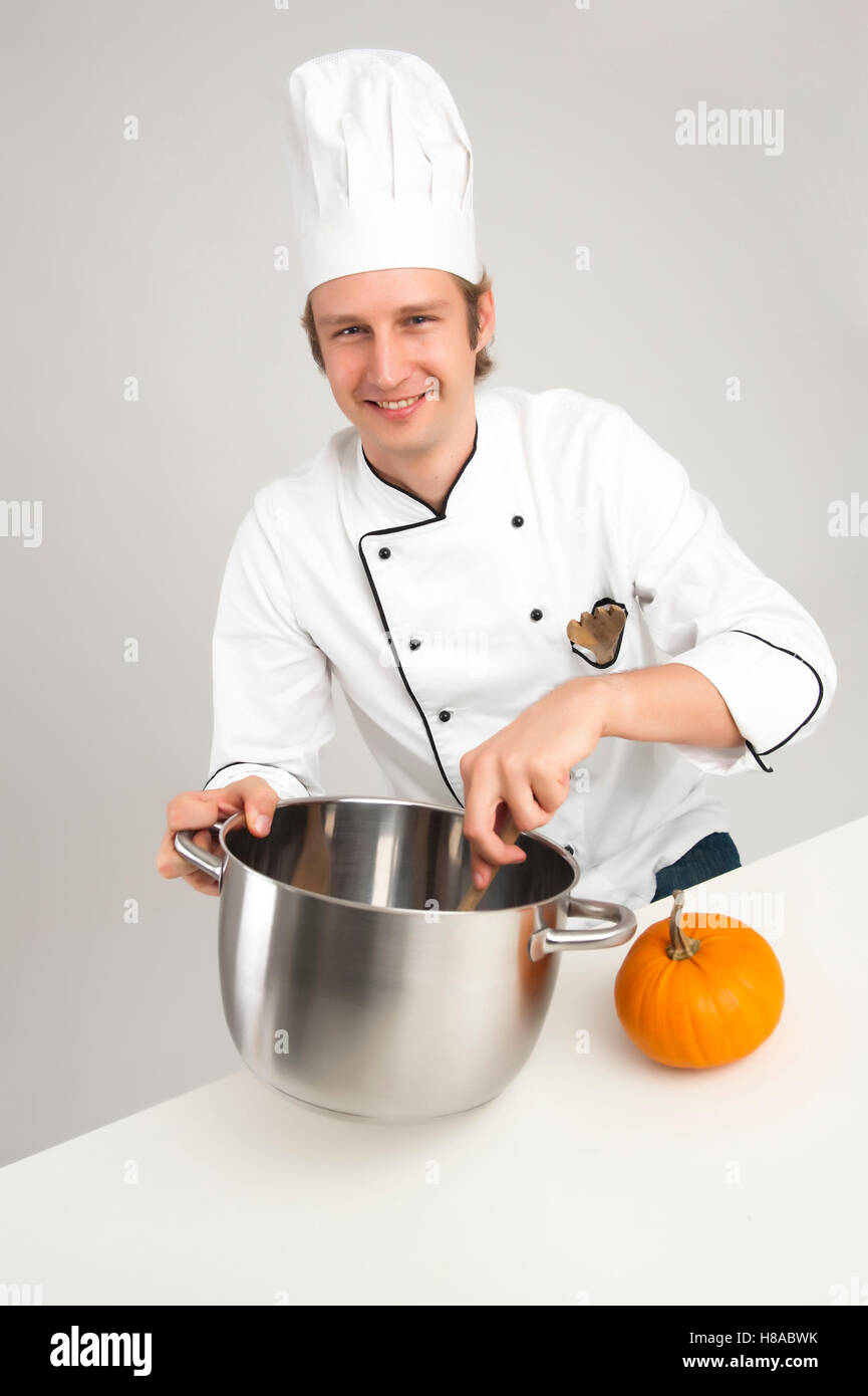 Chef stirring in a pot Stock Photo