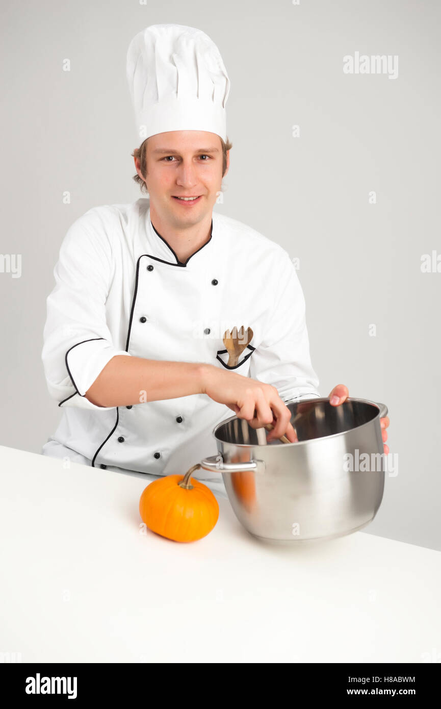 Chef stirring in a pot Stock Photo