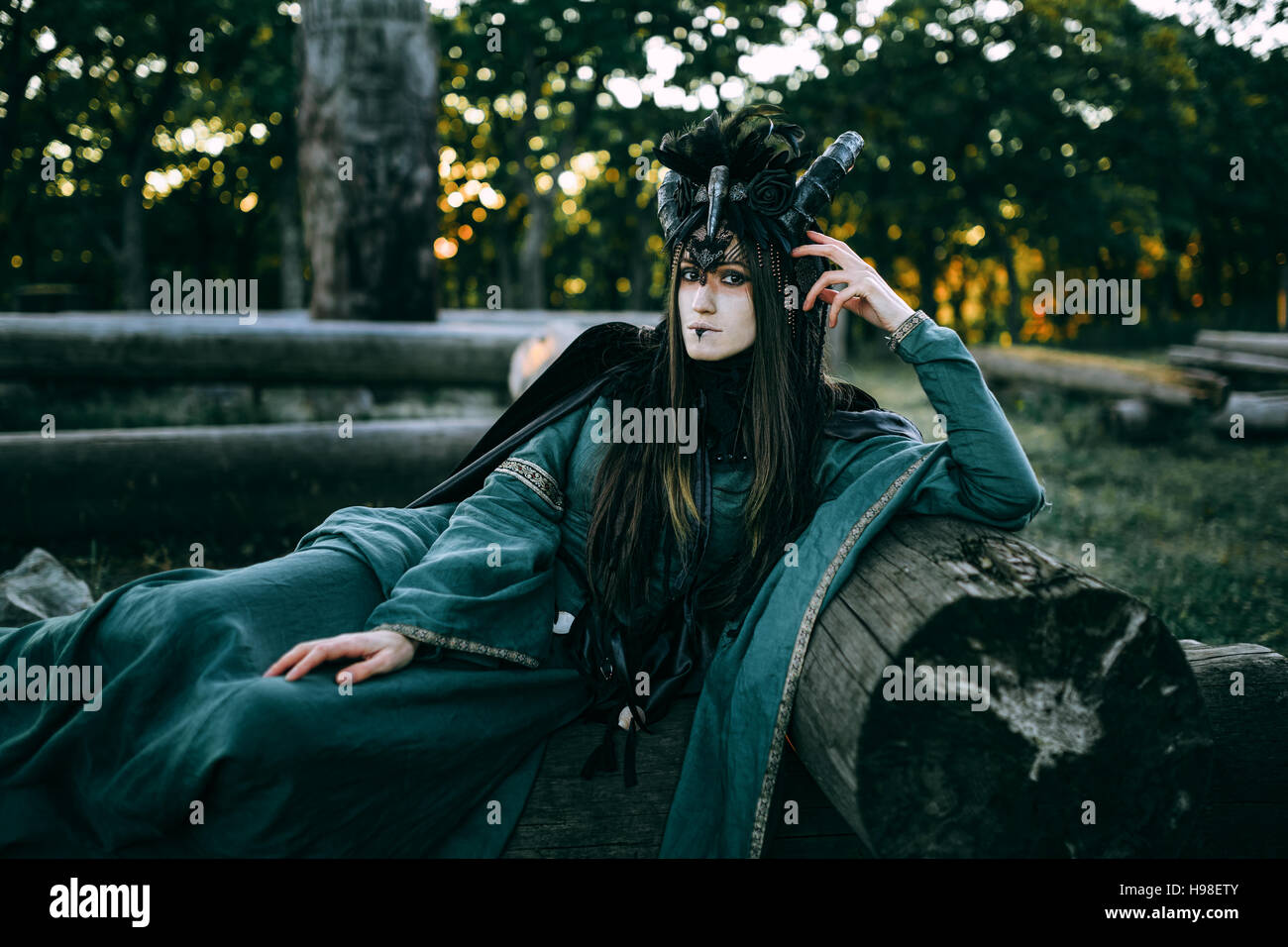 Woman-shaman with horns Stock Photo