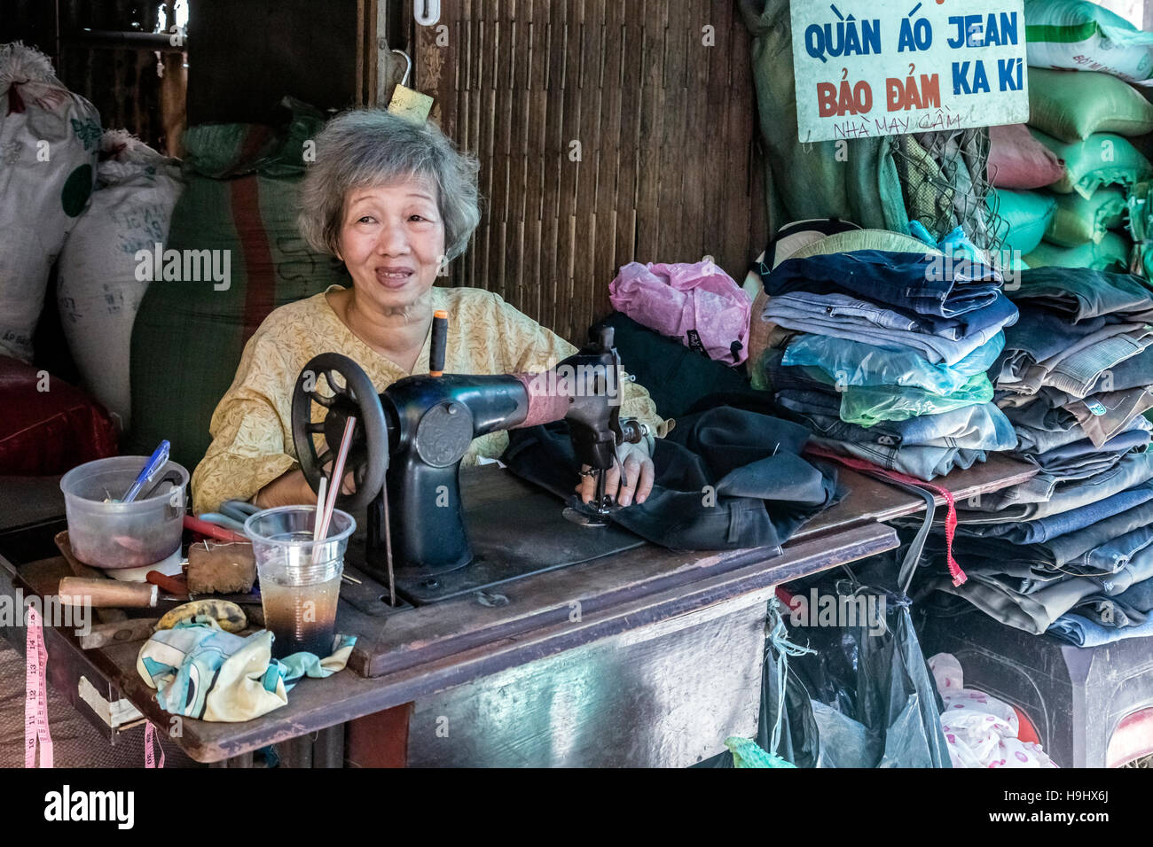 seamstress on a local market in Vinh Long, Mekong Delta, Vietnam, Asia Stock Photo