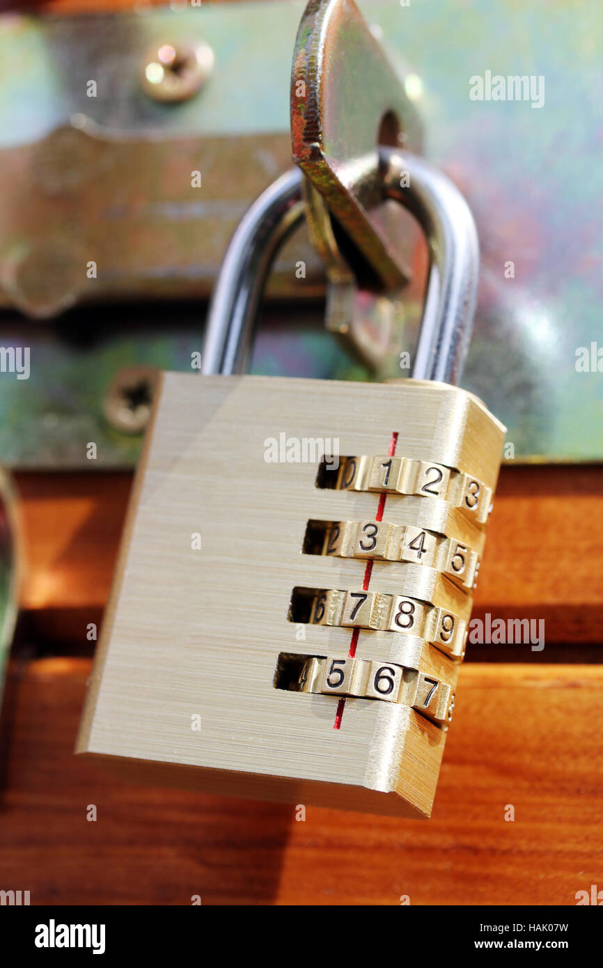 closed padlock on a wooden door Stock Photo