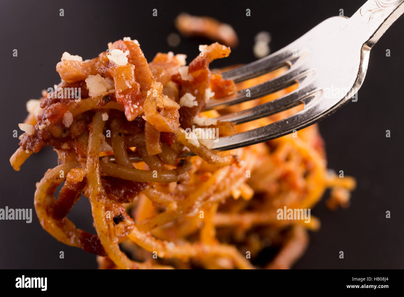 Spaghetti all'amatriciana, italian traditional food from the erarthquake land, made by twice michelin starred chef Angelo Troiani Stock Photo