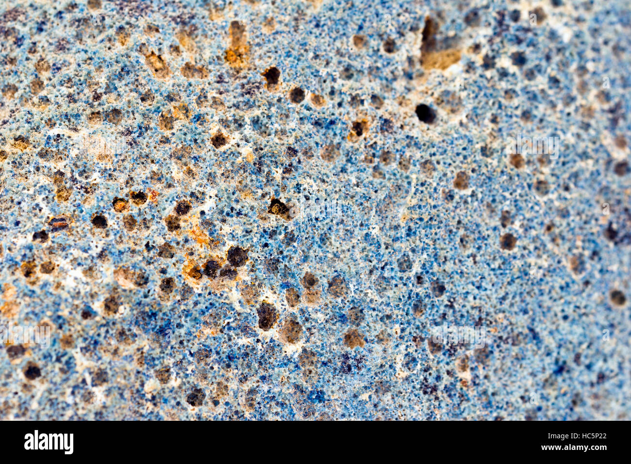 Vesicular texture on the exterior surface of a blue volcanic geode Stock Photo