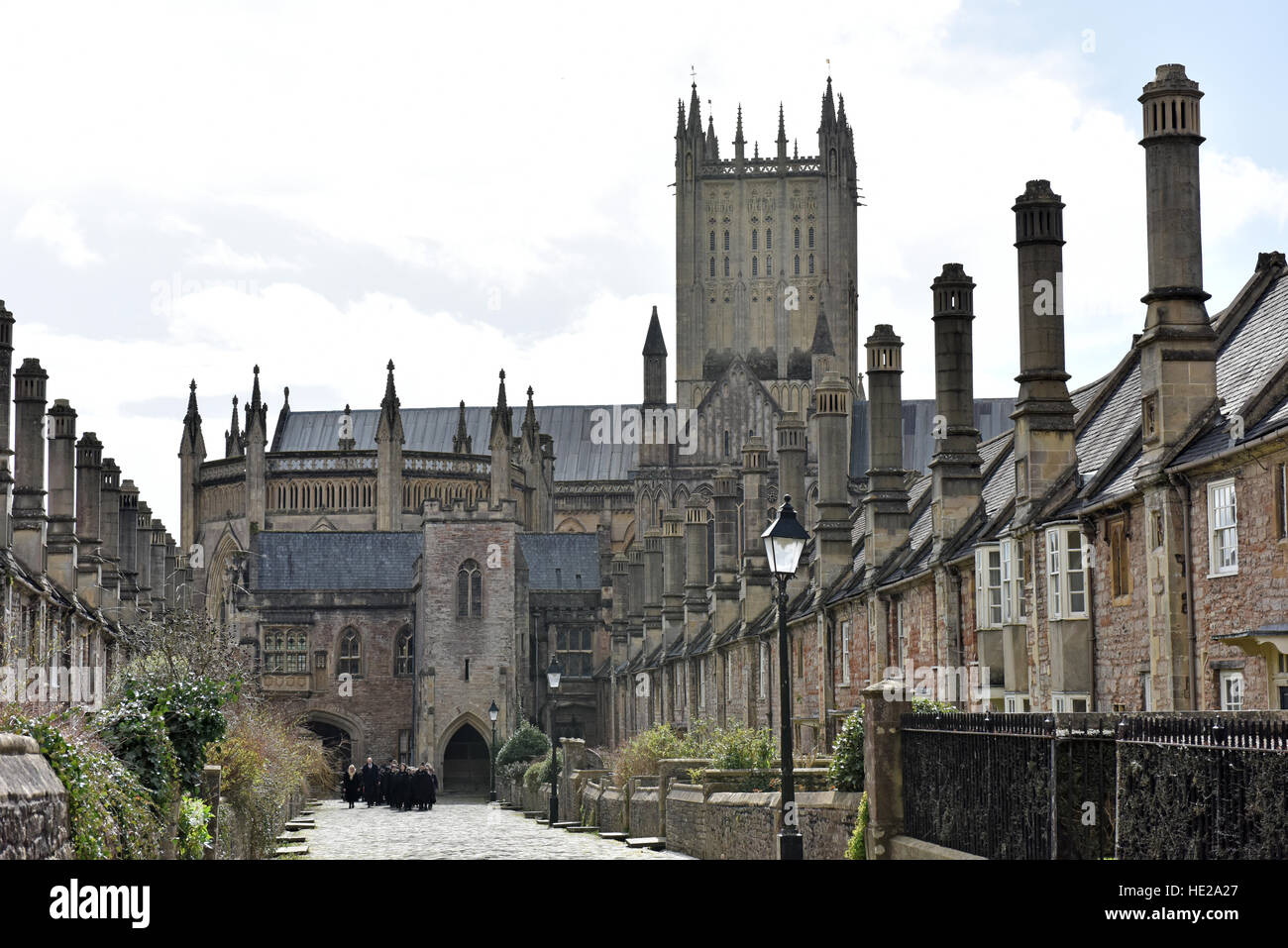 Choristers from Wells Cathedral Choir walking along Vicars Close in cloaks to evensong at the Cathedral on Easter Day. Stock Photo