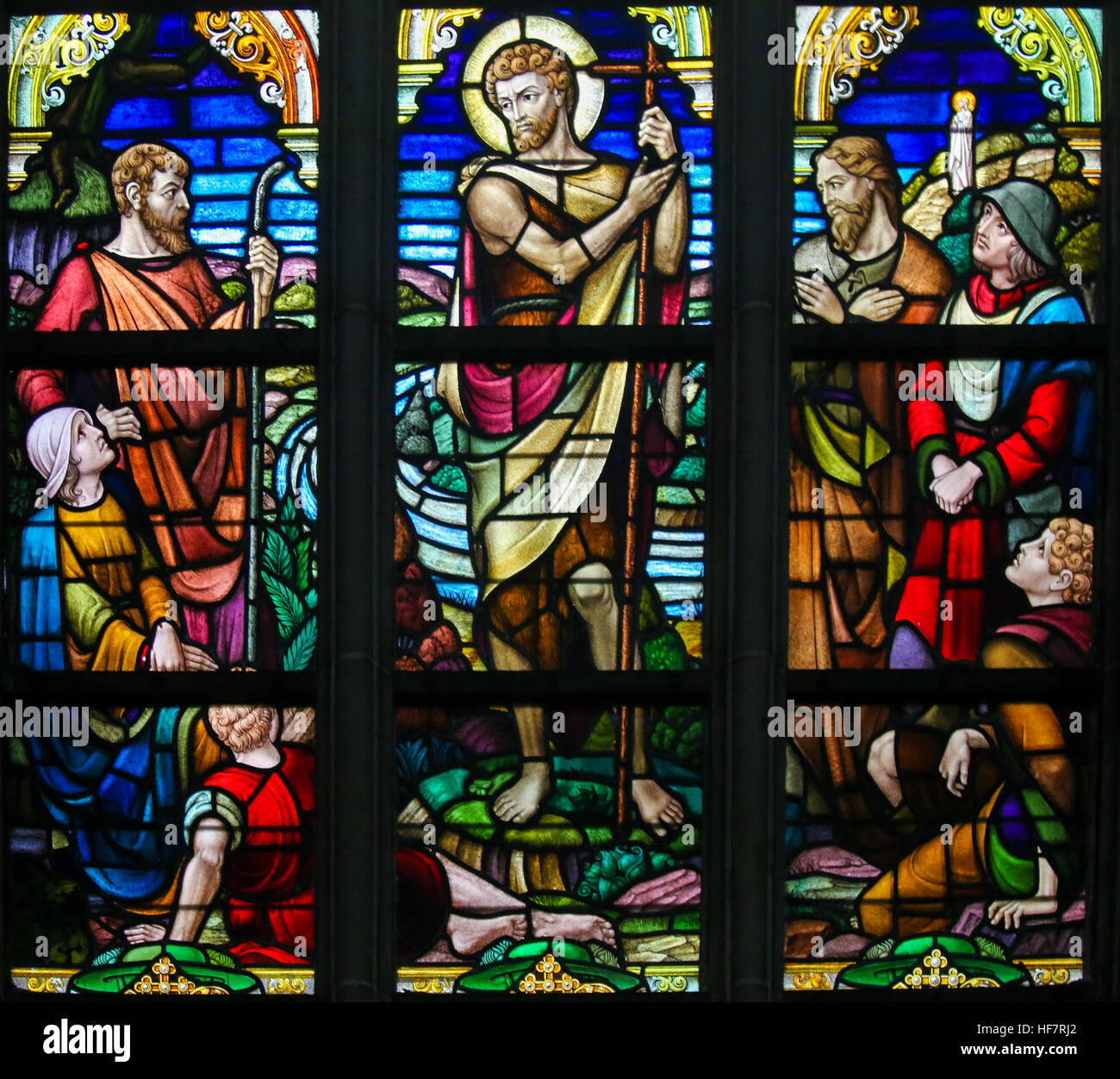 Stained Glass window depicting Saint John the Baptist in the Cathedral of Saint Bavo in Ghent, Flanders, Belgium. Stock Photo