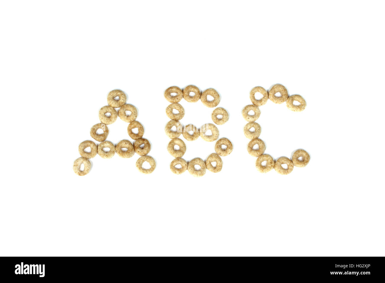 Round oat cereal spells out ABC on a pure white background Stock Photo