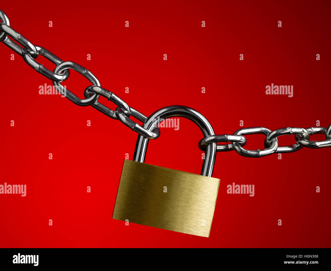 Padlock and chain on red Stock Photo