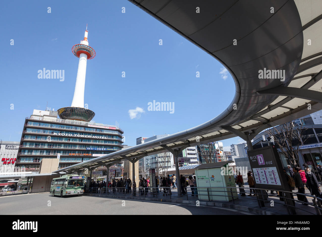 Kyoto, Japan - March 21, 2012: Kyoto Tower and Kyoto Tower Hotel viewed from Kyoto station bus terminal. The tower and it's supporting building house  Stock Photo