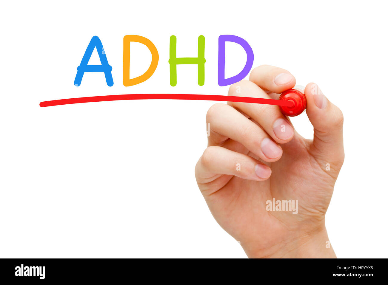 Hand writing ADHD Attention Deficit Hyperactivity Disorder with marker on transparent glass board. Stock Photo