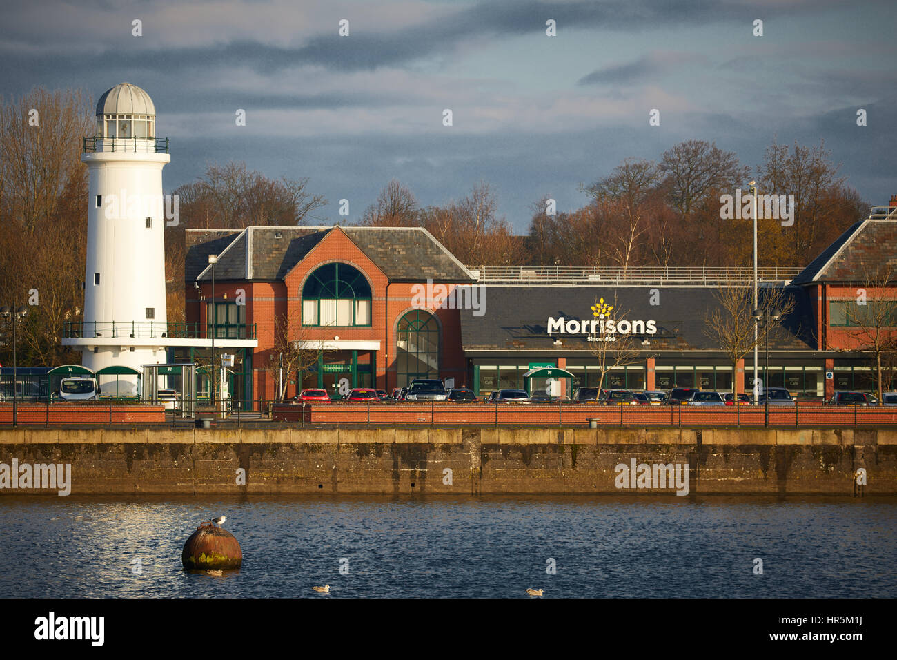 Blue sky at Historical Landmark Preston Marina Lighthouse at Edward Dock and now part of a Morrisons Supermarket Riversway Docklands, Lancashire, Engl Stock Photo