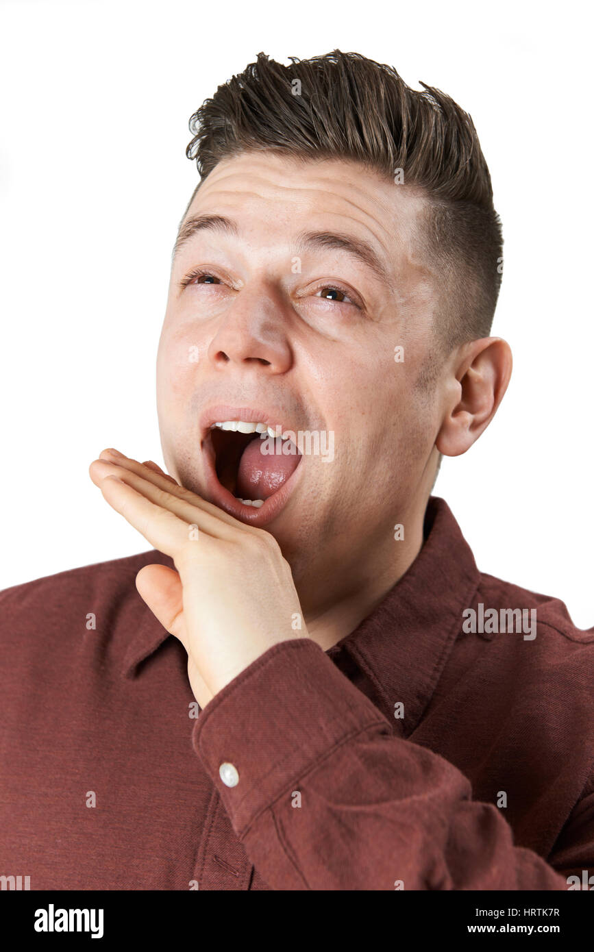 Studio Shot Of Man Yawning Stock Photo