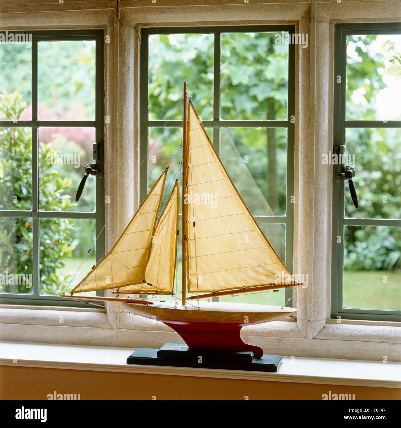 Model sailboat on windowsill. Stock Photo