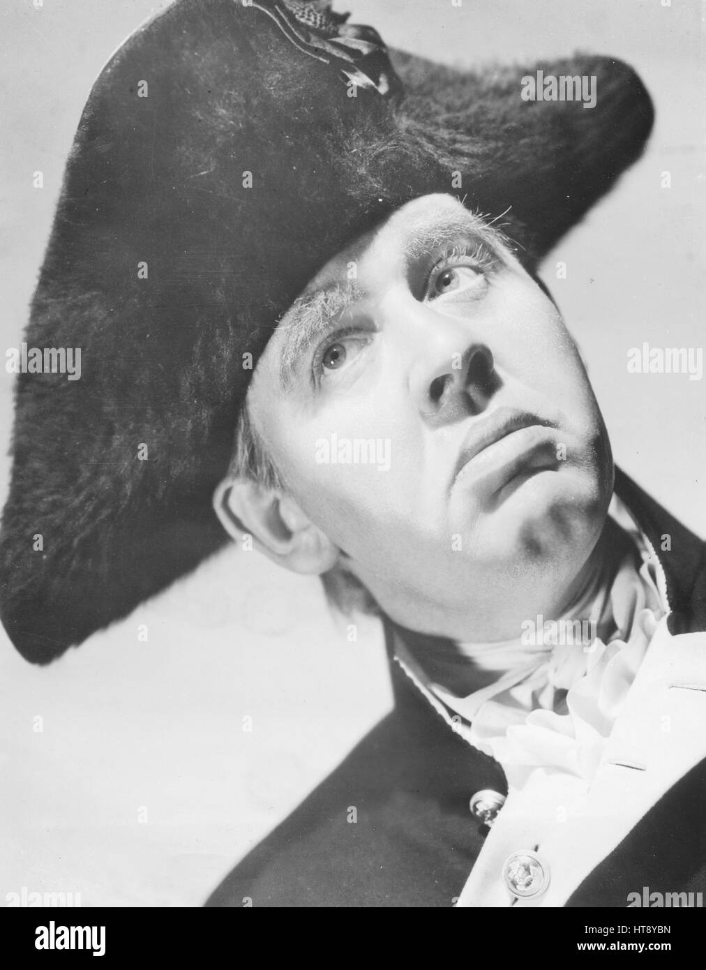 'No saltier sailor sailed the seven seas than Captain William Bligh, portrayed by Charles Laughton in Metro-Goldwyn-Mayer's ambitious production of 'Mutiny on the Bounty,' the true story of the most dramatic chapter in Maritime history, which is being directed by Frank Lloyd.' Stock Photo