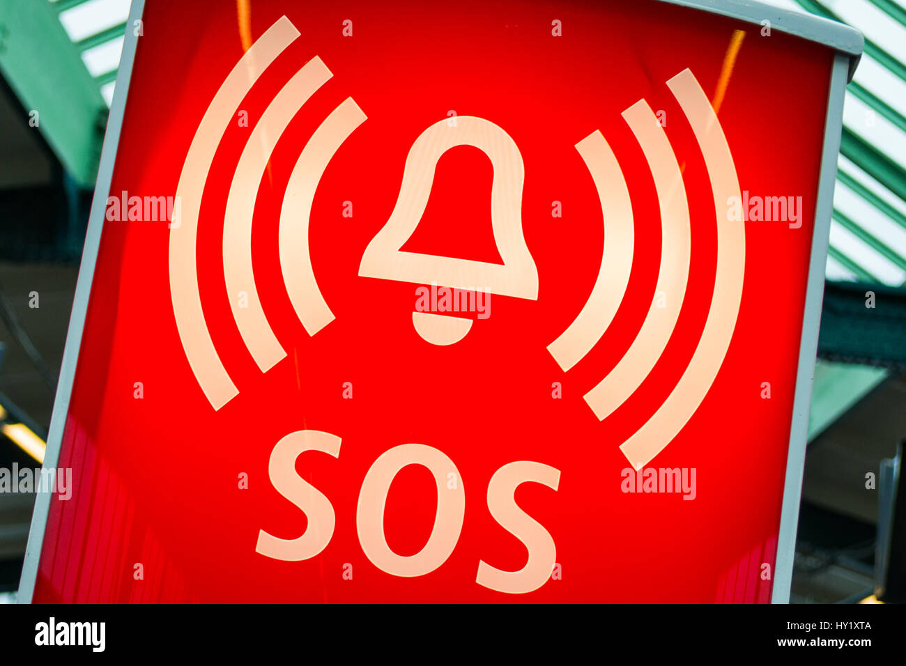 Orange backlit SOS sign with bell symbol Stock Photo