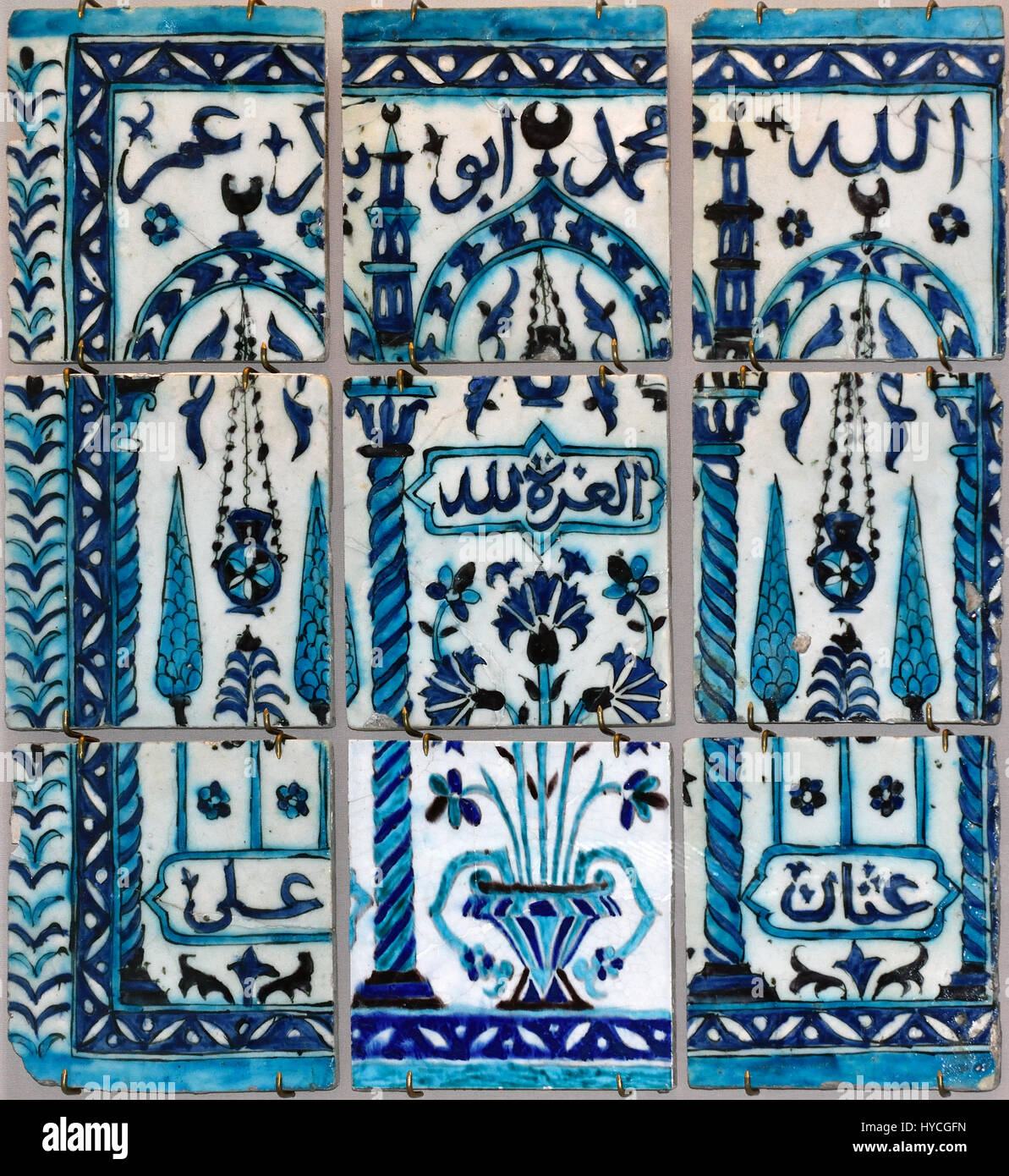 Glazed ceramic tile painted under glaze in manganese turquoise and cobalt. Inscribed with the names Muhammad and Abu Bakr. Iznik Ottoman dynasty 17 / 18th Century Made in: Iznik  Syrian Syria Stock Photo