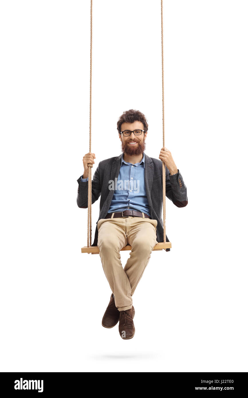 Bearded man sitting on a swing and looking at the camera isolated on white background Stock Photo