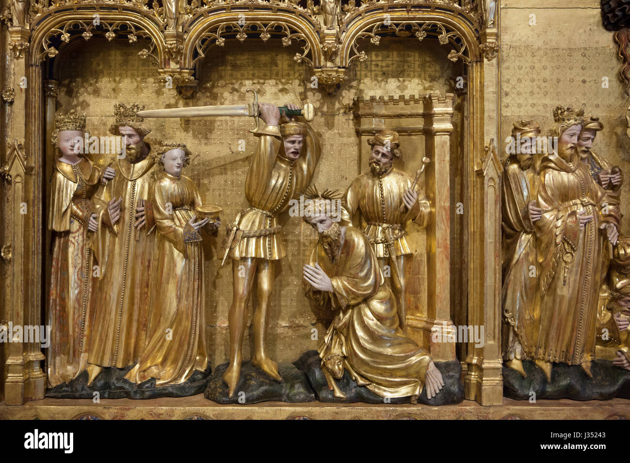 Beheading of Saint John the Baptist. Detail of the Altarpiece of the Saints and the Martyrs from the Chartreuse de Champmol by Flemish Renaissance sculptor Jacques de Baerze (1390-1399) on display in the Musee des Beaux-Arts de Dijon (Museum of Fine Arts) in Dijon, Burgundy, France. Stock Photo