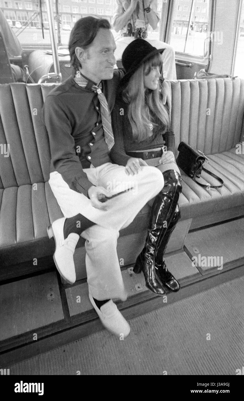 Hugh Hefner and Barbi Benton in an airport shuttle bus, 1970 Stock Photo