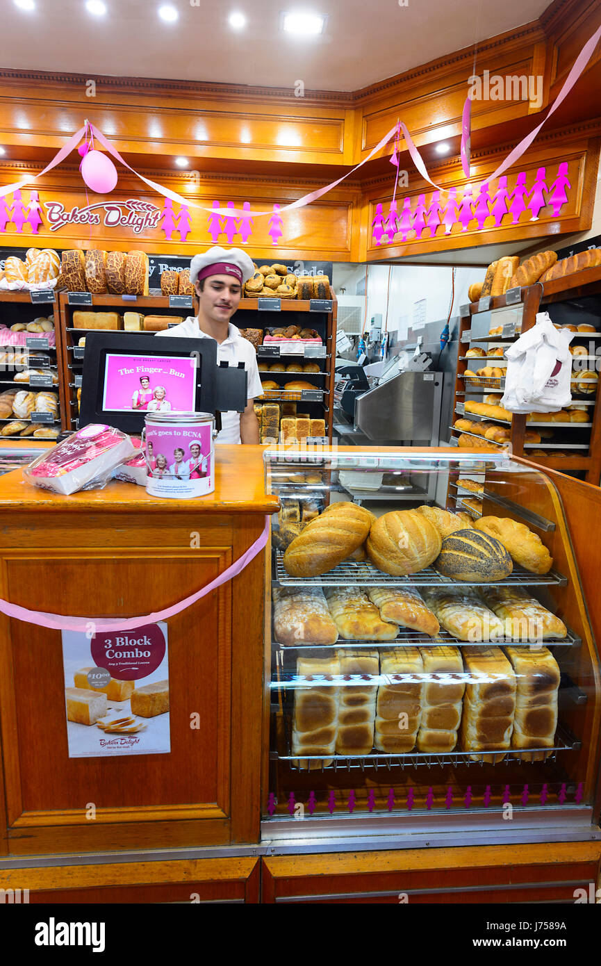 Baker wearing a Toque at Bakers Delight bakery shop, Kiama, New South Wales, NSW, Australia Stock Photo