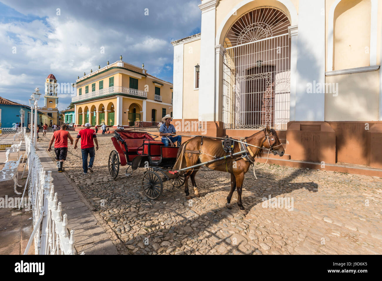 A horse-drawn cart known locally as a coche in Plaza Mayor, in the town of Trinidad, UNESCO, Cuba, West Indies, Caribbean Stock Photo