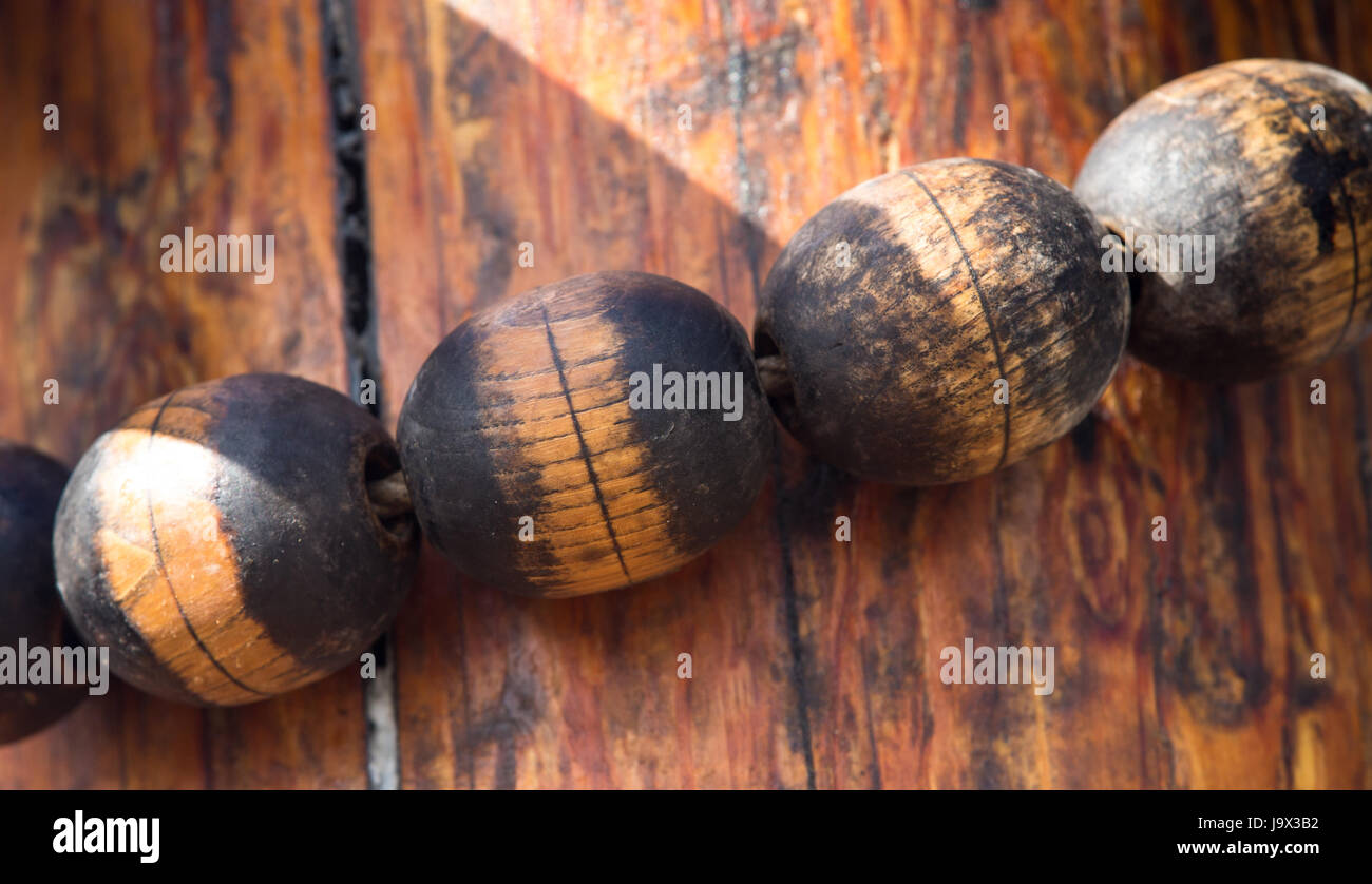 Detail of the rigging on the mainmast of an old sailing ship, showing a row of wooden fittings forming part of the mainsail rigging Stock Photo