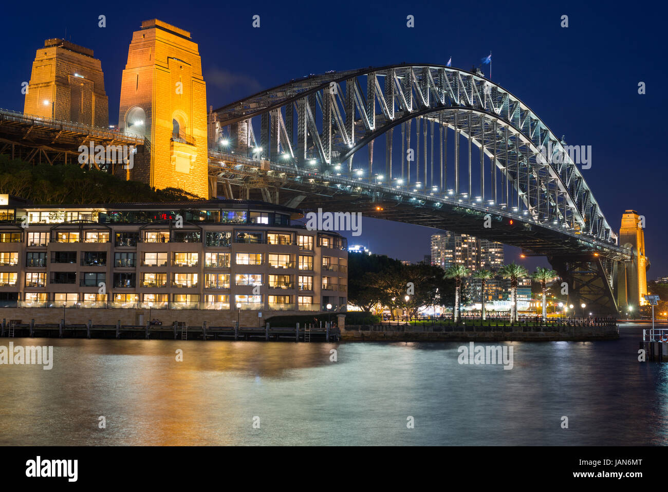 Sydney Harbour Bridge with Hyatt Park Hotel at dusk. Sydney, NSW, Australa. Stock Photo