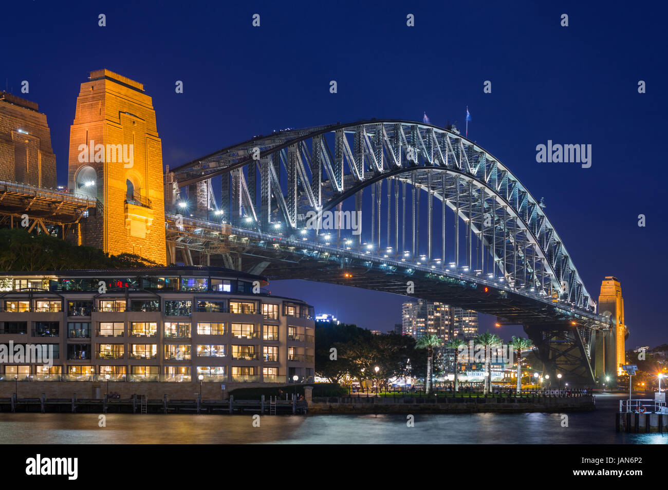 Sydney Harbour Bridge with Hyatt Park Hotel at dusk. Sydney, NSW, Australa. Stock Photo