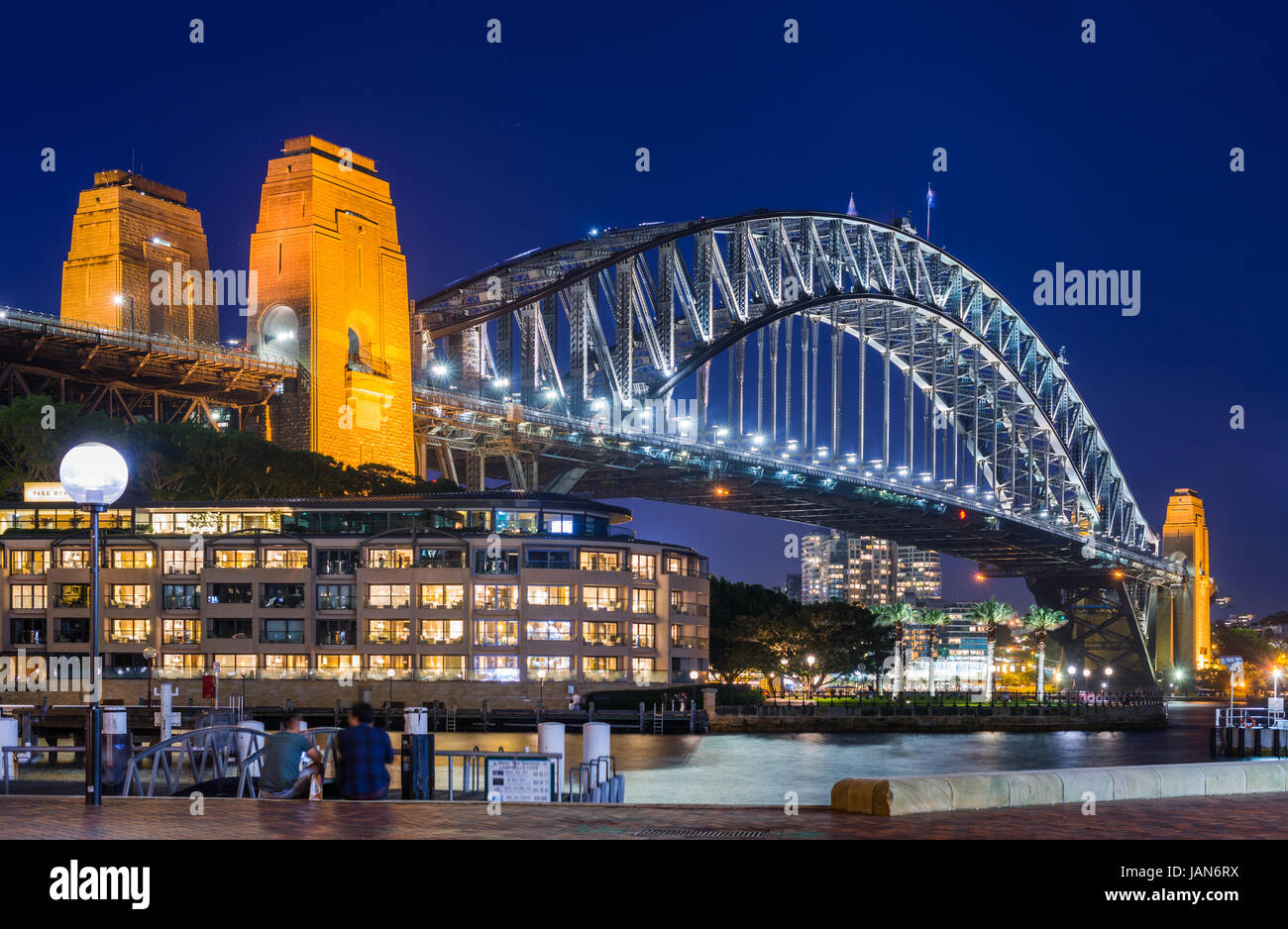 Sydney Harbour Bridge with Hyatt Park Hotel at dusk. Sydney, NSW, Australa. Stock Photo