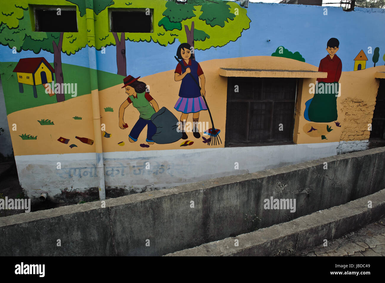 Mural painting advocating cleanliness + open sewer ( India) Stock Photo