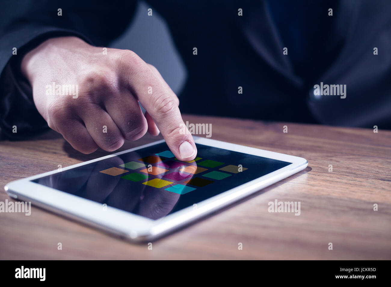 Mans hand touching on a tablet computer Stock Photo