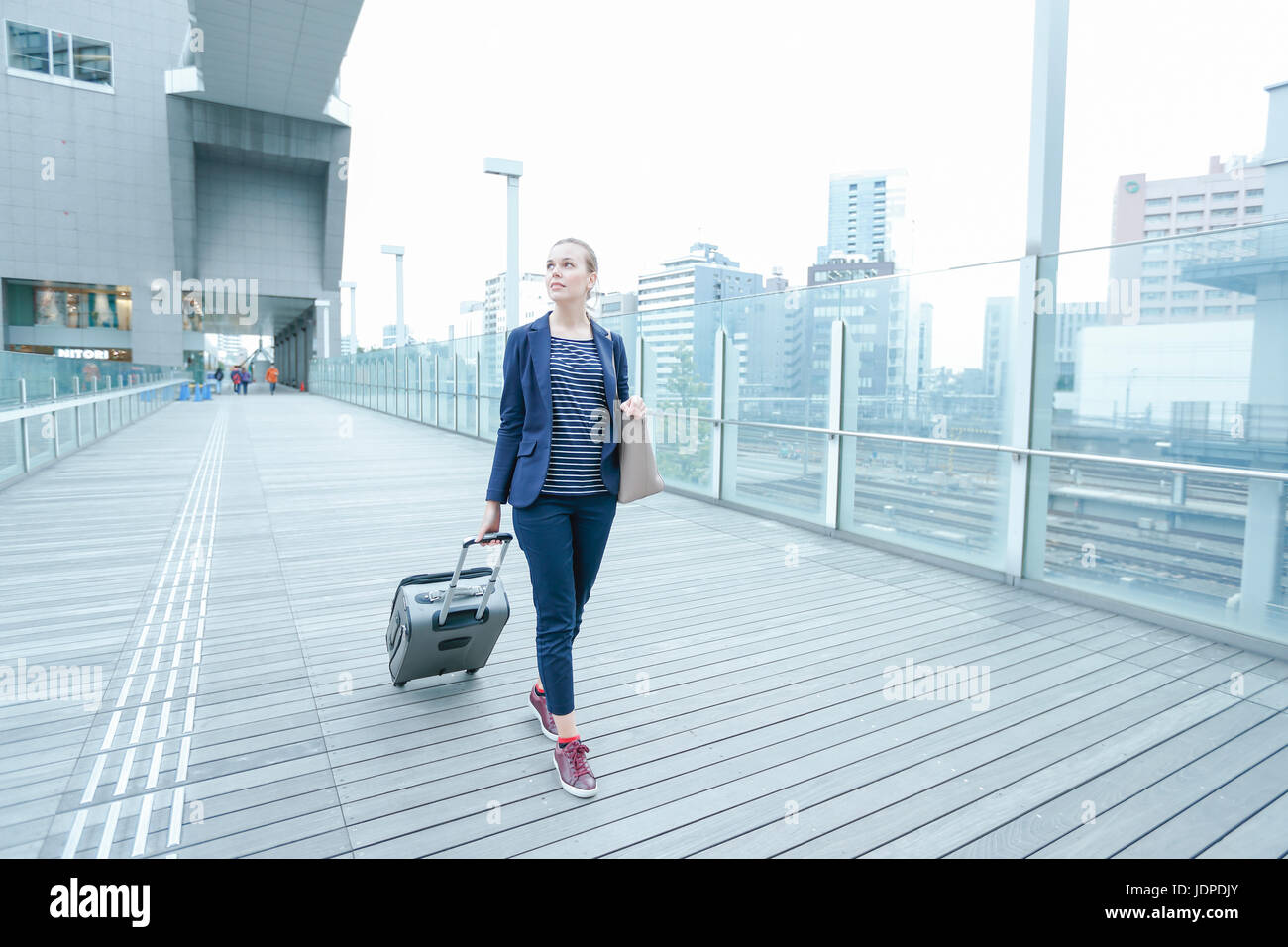 Caucasian woman downtown Tokyo, Japan Stock Photo