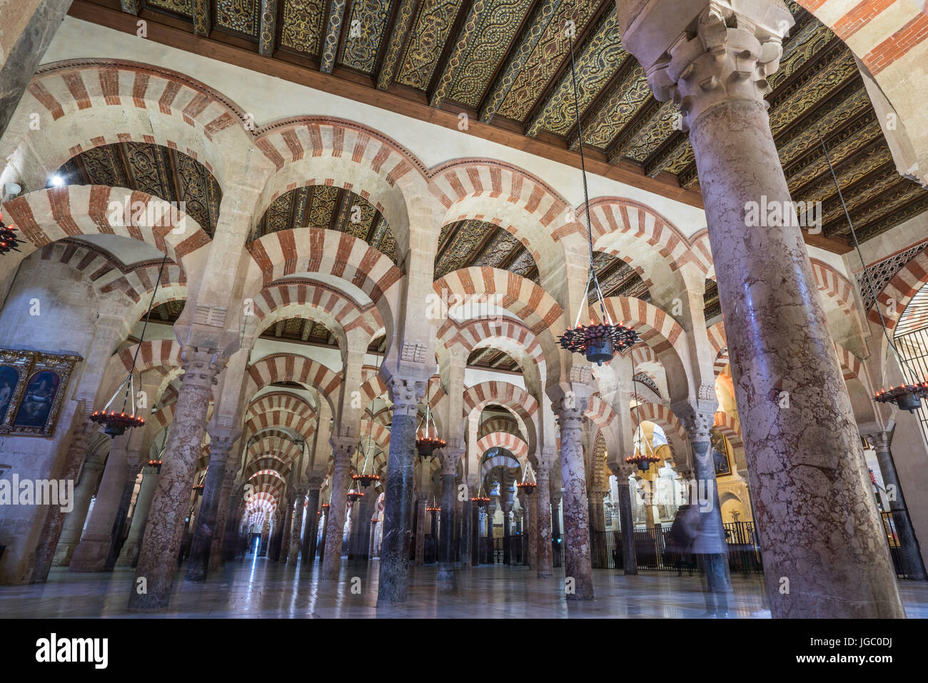 Hypostyle Hall filled with columns and archways in the Great Mosque or Mezquita-Catedral, Cordoba, Spain Stock Photo