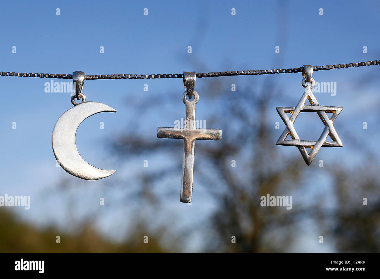 Symbols of islam, christianity and judaism. Stock Photo