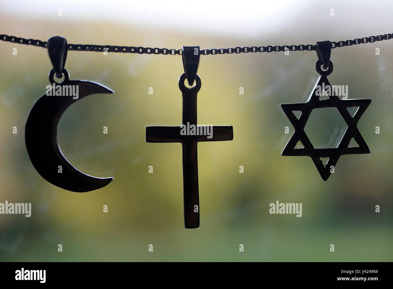 Symbols of islam, christianity and judaism. Stock Photo