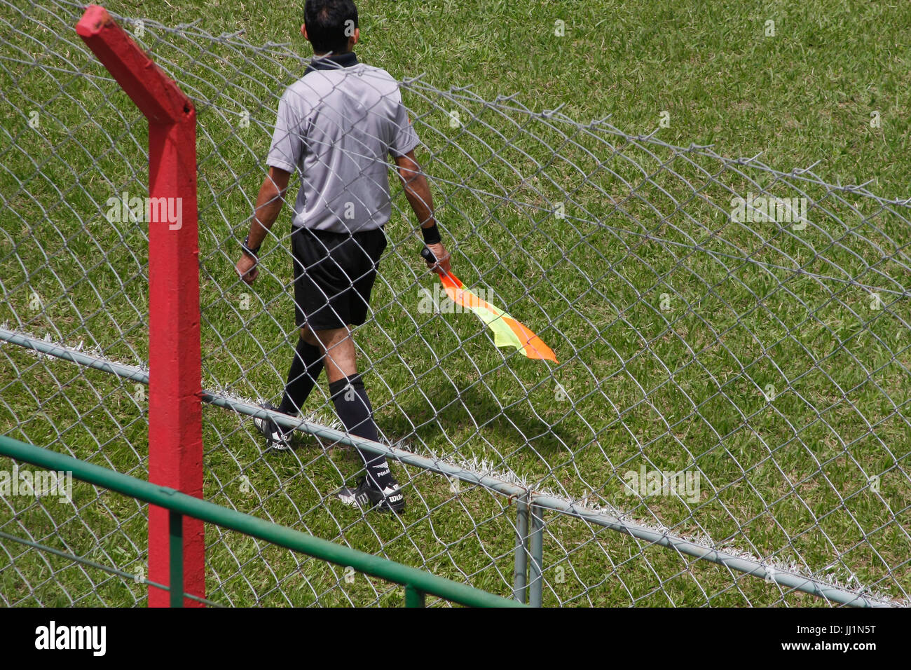 Small flag, man, field, São Paulo, Brazil Stock Photo