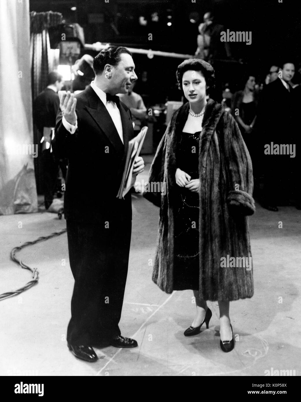 Ronnie Waldman, chief of BBC Television Light Entertainment and a well-known radio and TV personality, escorts Princess Margaret on a tour of Studio G at the BBC's Lime Grove Television Studios in London. Stock Photo