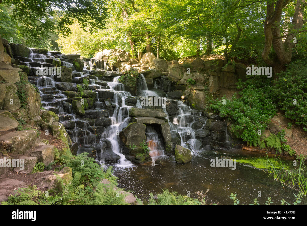 View of the cascade, a man-made waterfall at Virginia Water in Surrey, UK Stock Photo