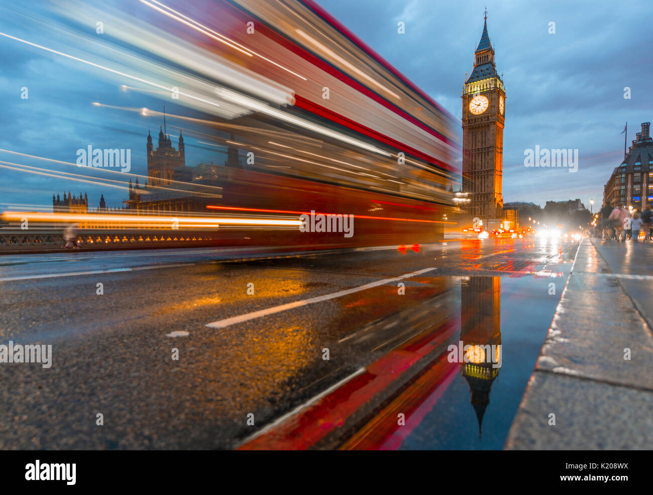 Light traces, double-deck bus, Westminster Bridge, Palace of Westminster, Houses of Parliament with reflection, Big Ben Stock Photo