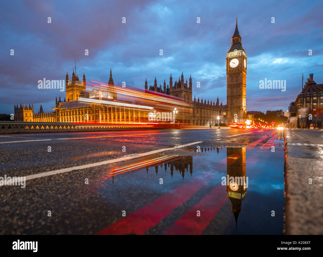 Light traces, double-deck bus, Westminster Bridge, Palace of Westminster, Houses of Parliament with reflection, Big Ben Stock Photo