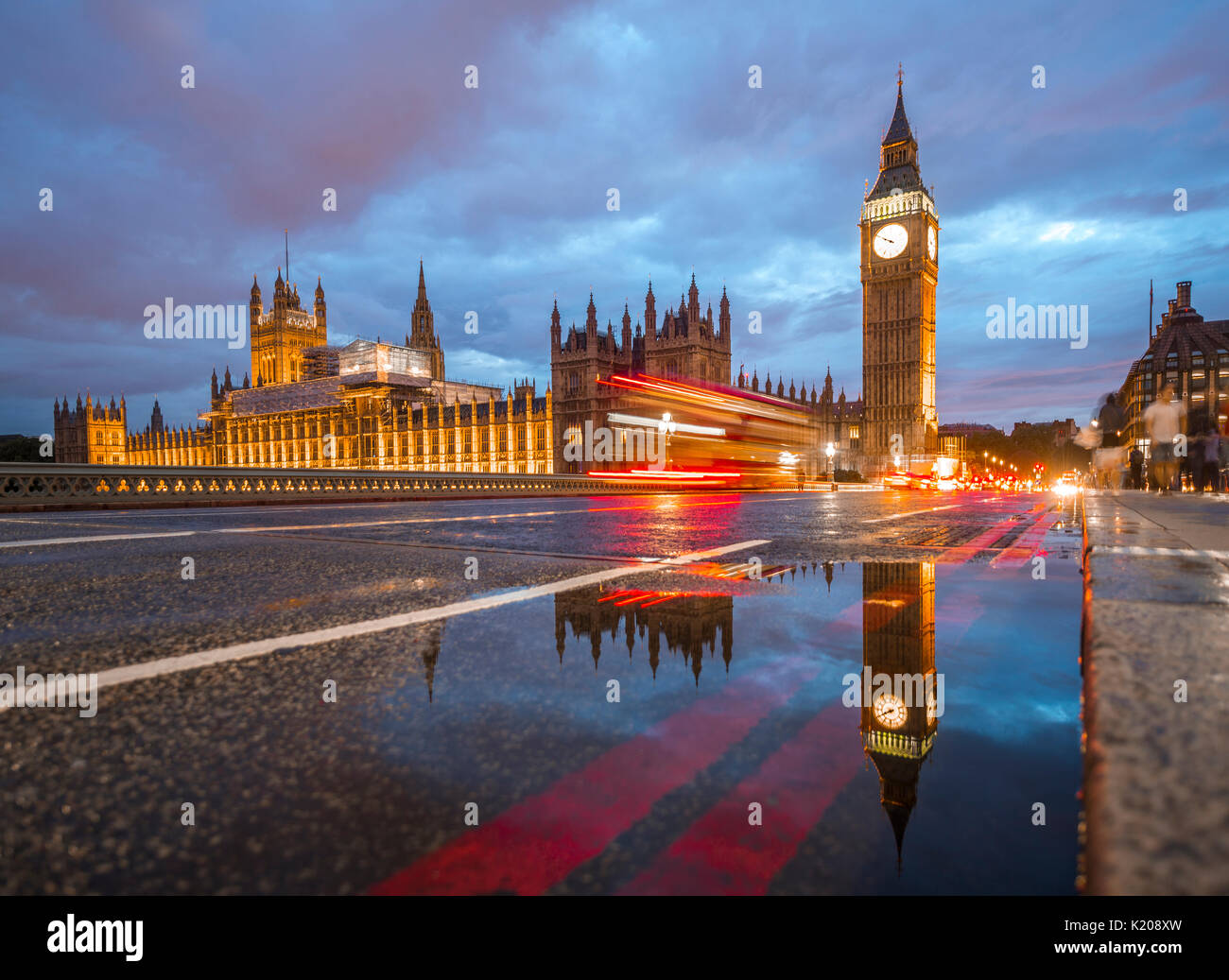 Light traces, double-deck bus, Westminster Bridge, Palace of Westminster, Houses of Parliament with reflection, Big Ben Stock Photo