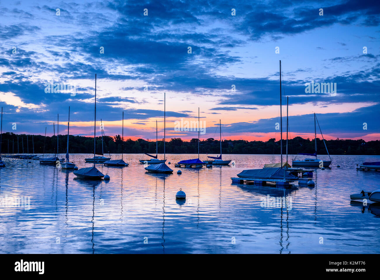 Sailboats at dawn on Lake Harriet in Minneapolis, Minnesota. Stock Photo