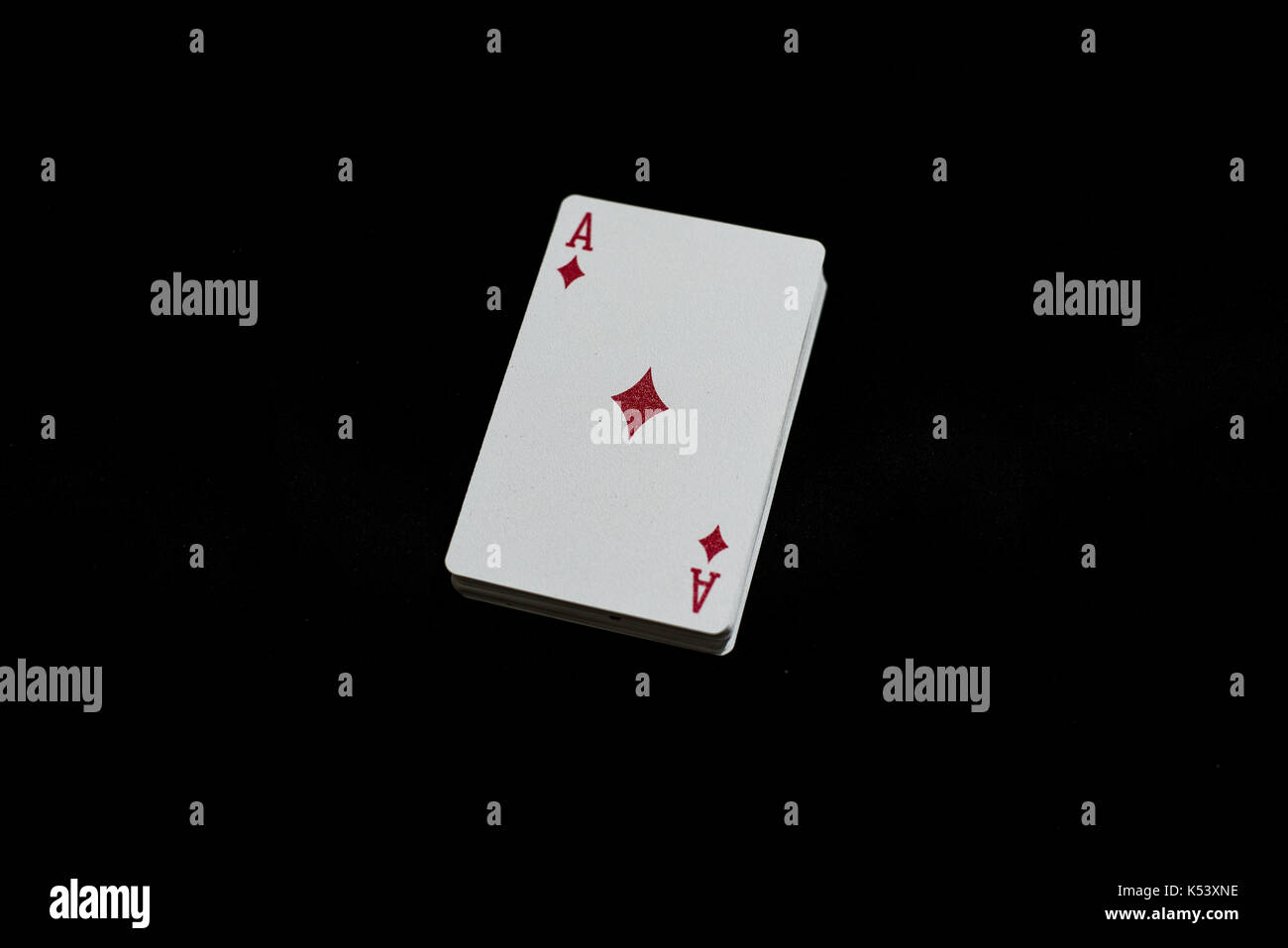 A deck of playing cards on a black table Stock Photo