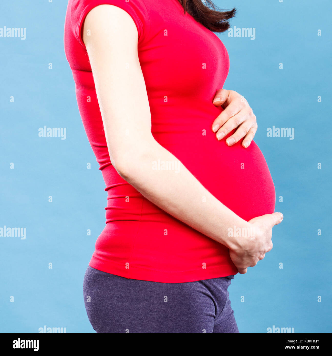 Pregnant Woman Holding Belly In Pain