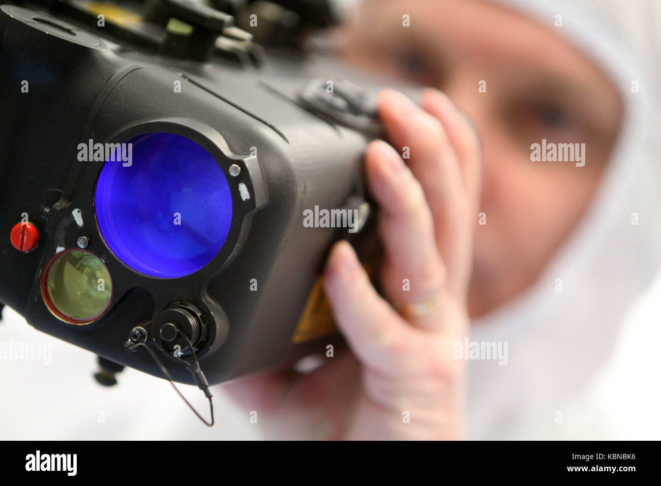 Scientists working in clean room environment Stock Photo