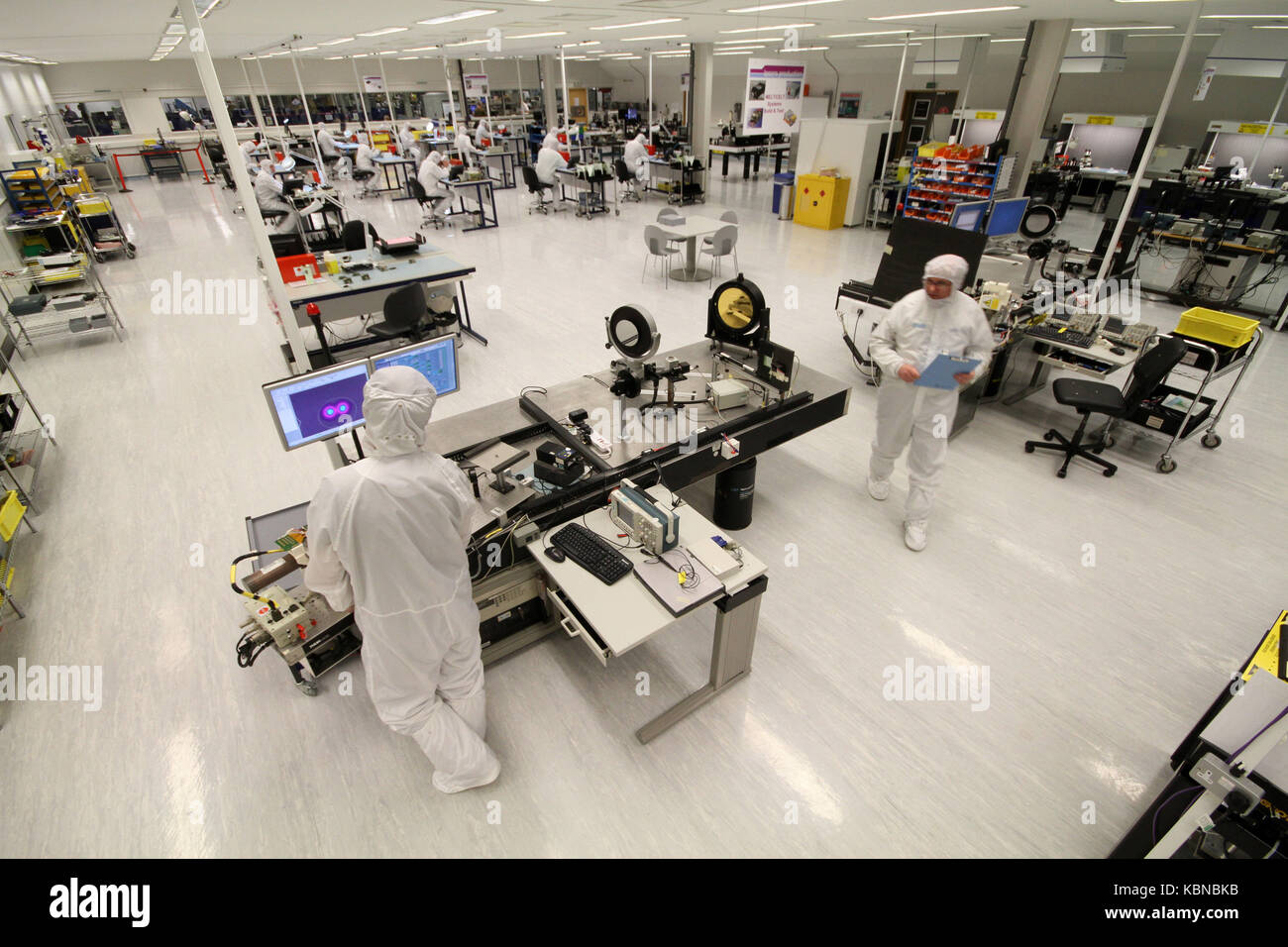 Scientists working in clean room environment Stock Photo